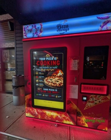 Pizza Always kosher pizza vending machine with touchscreen in front of Quick Kosher 2 Go in Lakewood, NJ