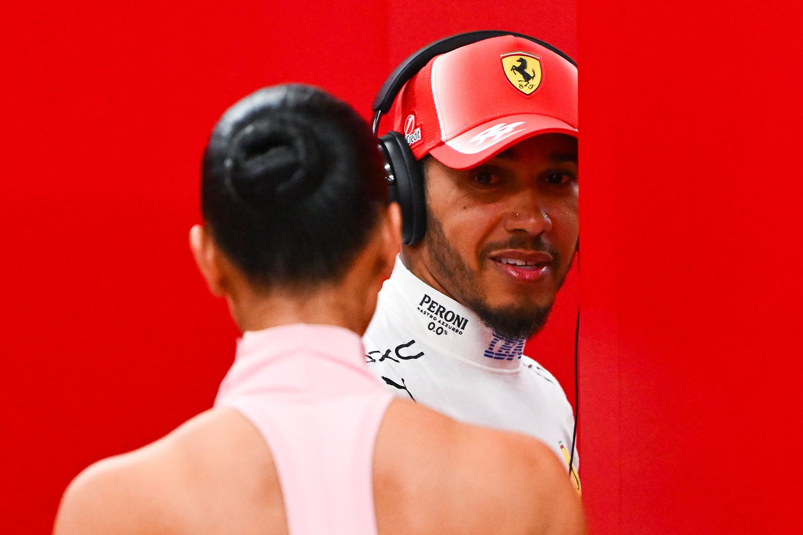 SINGAPORE SINGAPORE OCTOBER 10 Lewis Hamilton of Great Britain and Scuderia Ferrari and Kim Kardashian in the garage...