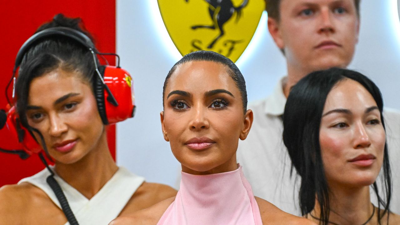 Forget Ferrari Red: Kim Kardashian Pulls up to the Paddock in Pastel Pink