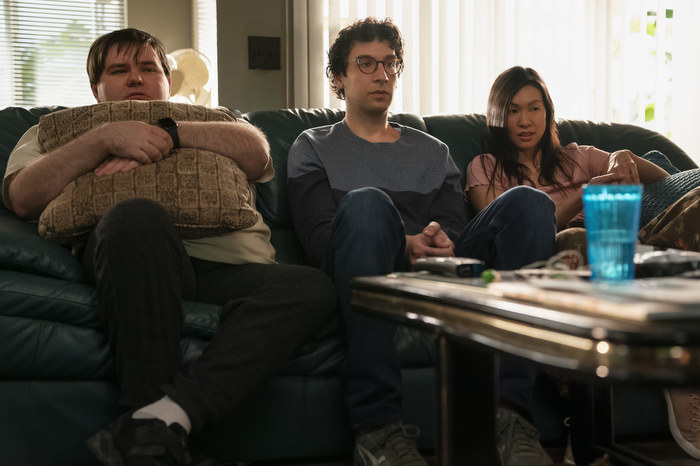 Three autistic friends sit on a couch in As We See It on Prime Video.