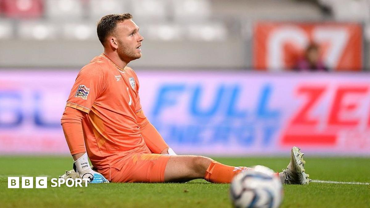 Daniel Peretz sits on the floor while on the pitch