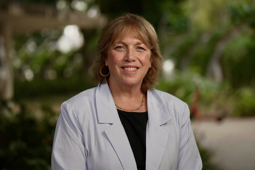 a woman in a blue blazer