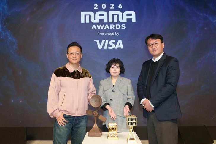 From left, Shin Hyung-kwan, head of CJ ENM’s music content business division; Yoon Shin-hye, head of CJ ENM’s Mnet business division; and Park Chan-uk, head of CJ ENM’s convention business division, pose during a media day for the 2026 MAMA Awards at the Eliena Hotel in Gangnam District, Seoul, Thursday. Courtesy of CJ ENM