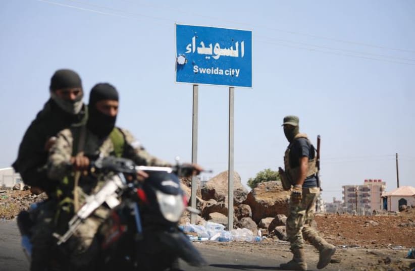 Tribal and Bedouin fighters deploy in the predominantly Druze city of Sweida, amid clashes with Druze gunmen in July 2025. 