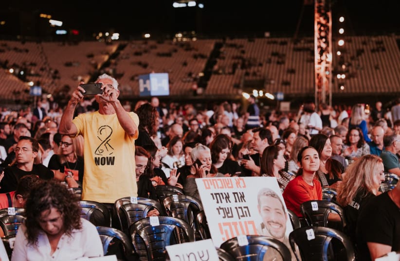 Israelis attend a memorial ceremony commemorating the October 7 massacre; illustrative.