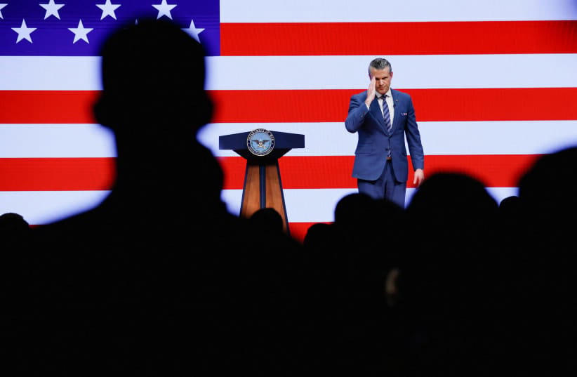 US Defense Secretary Pete Hegseth salutes as he delivers his 2026 "State of the Force" address to US junior officers and enlisted leaders at Marine Corps Base Quantico in Quantico, Virginia, US, September 30, 2026.