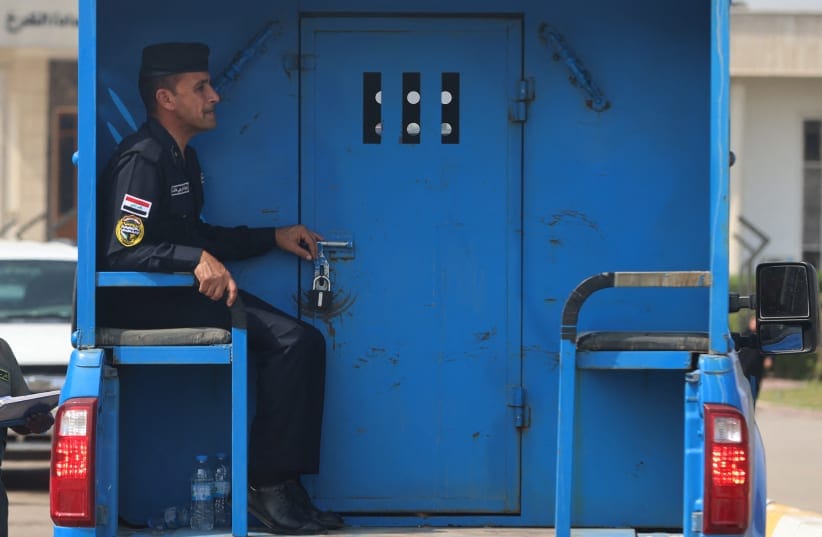 An Iraqi police patrol transports Iraqi detainees to the Karkh Court during the trial of six French citizens accused of terrorism in Baghdad, on October 5, 2026; Illustrative.