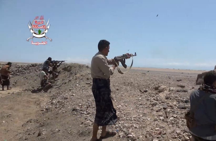 Pro-Saudi-backed Yemeni government fighters fire their weapons during what government forces say was an advance against the Iran-backed Houthis, near Dhubab, Taiz Governorate, Yemen, October 5, 2026.