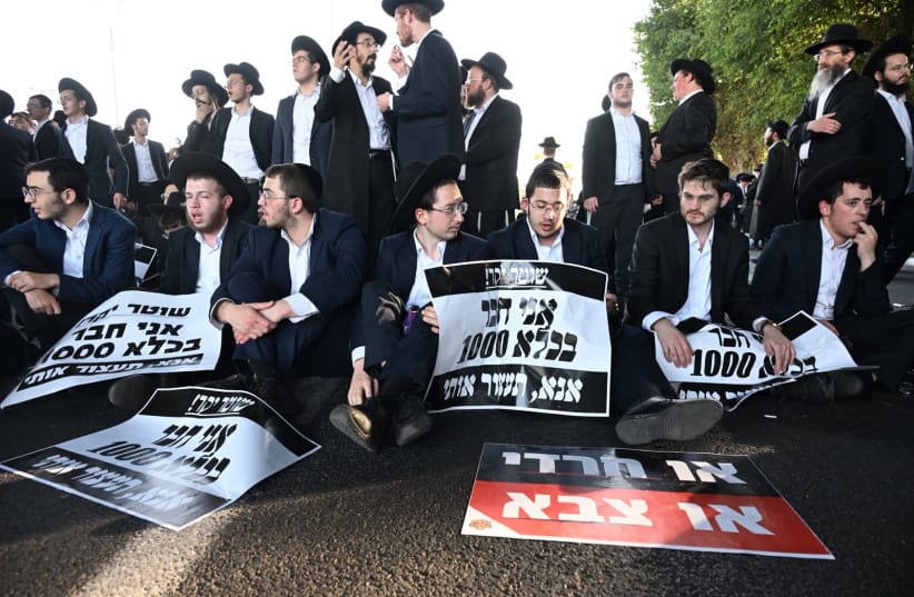 Haredi (ultra-Orthodox) protesters block traffic on Highway 4 during anti-draft demonstration, October 8, 2026.