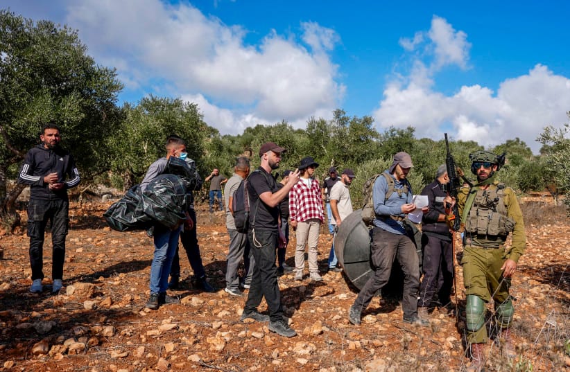 Israeli security forces remove Palestinians and left-wing activists from olive groves during the olive harvest season in the West Bank village of Beita, near Nablus, October 2, 2026
