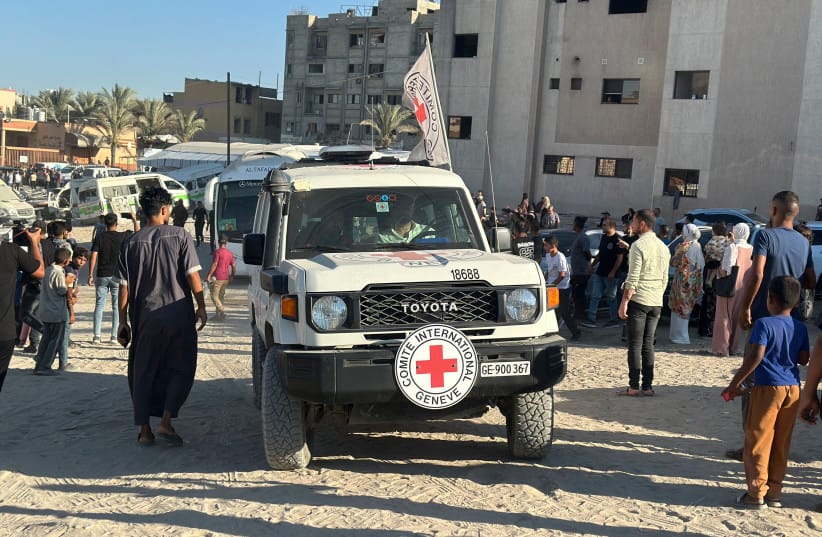 People gather as International Committee of the Red Cross (ICRC) vehicles arrive with released Palestinian detainees at Nasser Medical Complex in Khan Yunis, Gaza Strip, on July 27, 2026.