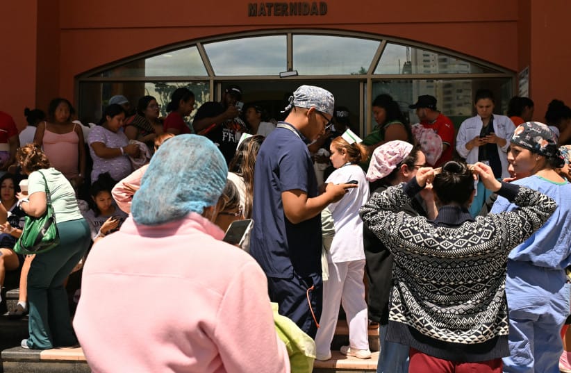 People stand outside the maternity ward of the Santo Tomas hospital, after a severe magnitude 8 earthquake hit the country, in Panama City on October 9, 2026.