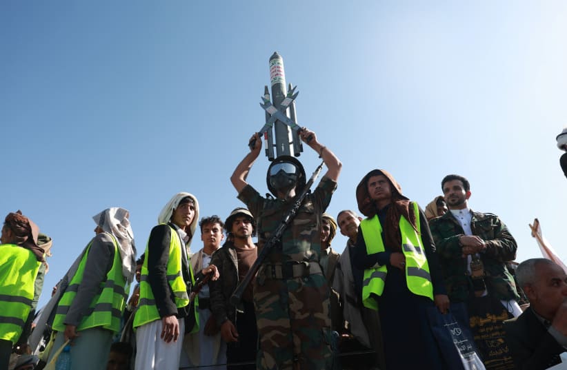 A Houthi supporter wearing a military uniform holds a mock missile as he joins Houthi supporters in a rally to show support to the movement as fighting intensifies across several Yemeni fronts, in Sana'a, Yemen, October 9, 2026