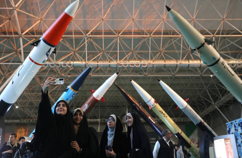 Women take a selfie at the Islamic Revolutionary Guard Corps (IRGC) Aerospace Force Museum in Tehran, Iran, November 12, 2025 (credit: MAJID ASGARIPOUR/WANA