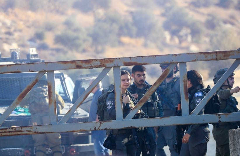 Israeli military forces fire tear gas and disperse Palestinian farmers, preventing them from continuing the olive harvest as they attempt to cross an iron gate erected by the Israeli army in the village of Salem, east of Nablus in the West Bank, October 17, 2026.