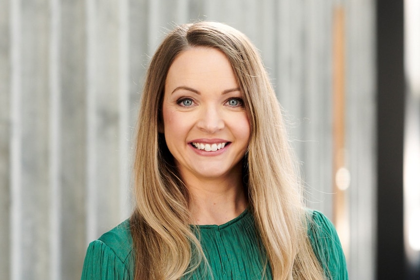 Nicola Powell smiles at the camera.