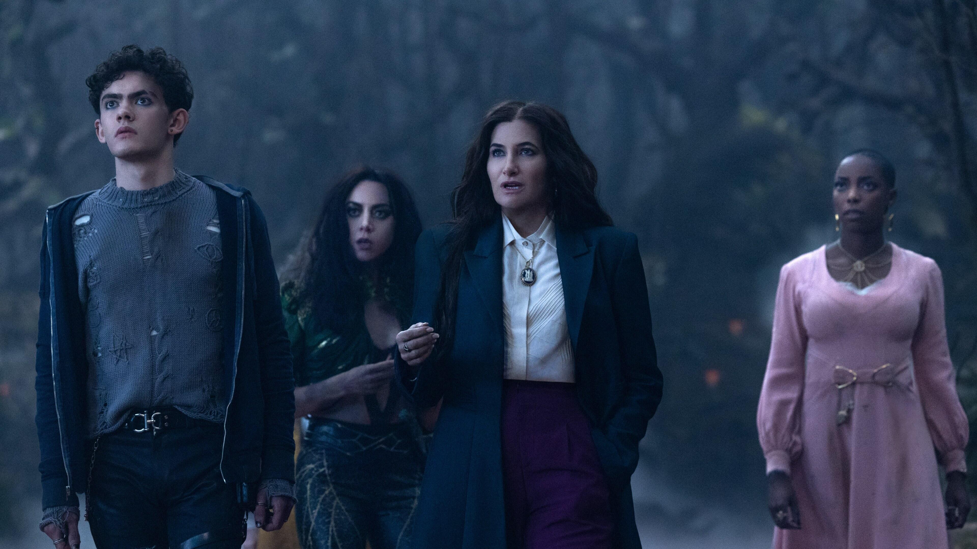 teen and three witches stand in woods looking ahead in Agatha All Along