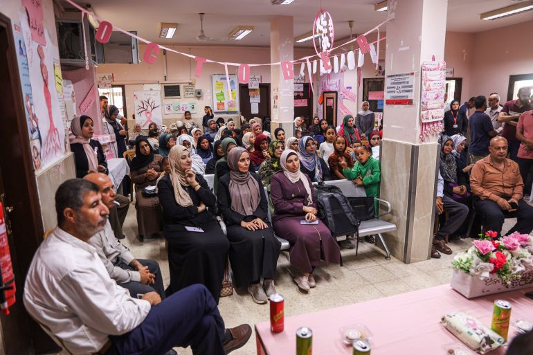 Patients and their loved ones attend a breast cancer awareness event organised by Gaza’s Ministry of Health as part of ‘Pink October’ or Breast Cancer Awareness Month