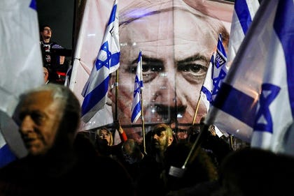 A protest against the Netanyahu government's attempts to overhaul Israel's judiciary in Tel Aviv in 2023. Credit: Ohad Zwigenberg / AP A protest against the Netanyahu government's attempts to overhaul Israel's judiciary in Tel Aviv in 2023.