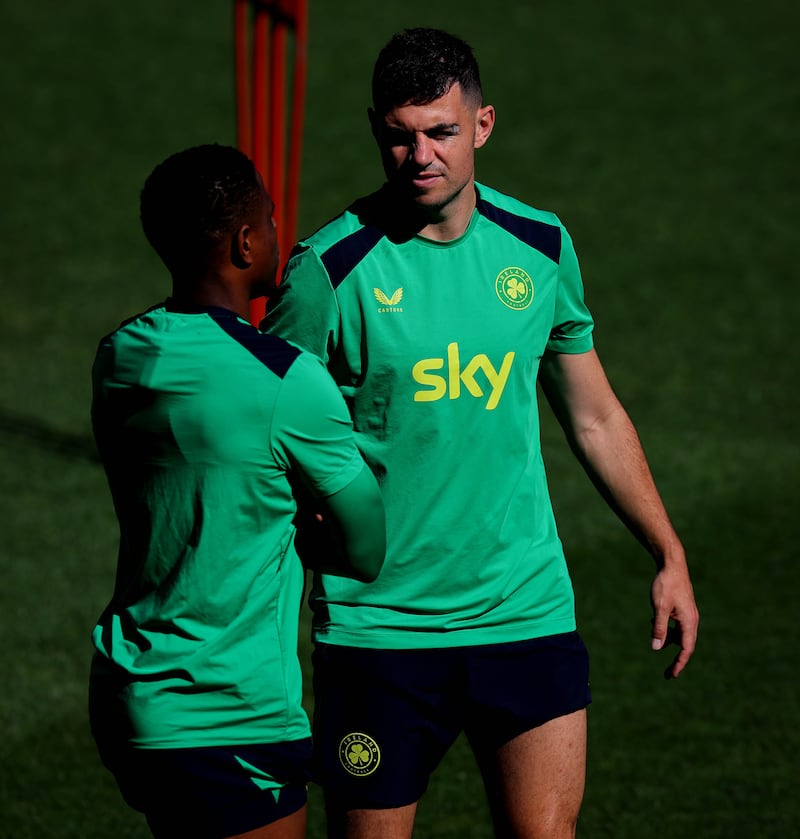 Chiedozie Ogbene and John Egan during Ireland training at the TSC Arena in Bačka Topola. Photograph: Ryan Byrne/Inpho