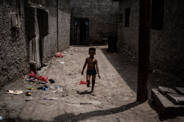 A child walks through a neighborhood in Aden during the day. A generation of children in the city has grown up knowing electricity as something that comes and goes, rather than as a constant part of daily life. Photo: Belal Khaled
