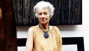 Peggy Guggenheim at her Venice home and museum in 1979. She wears a gold Fortuny evening dress and jewelry of her own.