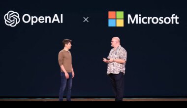 OpenAI CEO Sam Altman (L) speaks with Microsoft Chief Technology Officer and Executive VP of Artificial Intelligence Kevin Scott