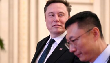 Tech billionaire and Tesla founder Elon Musk walks through the Great Hall of the People.
