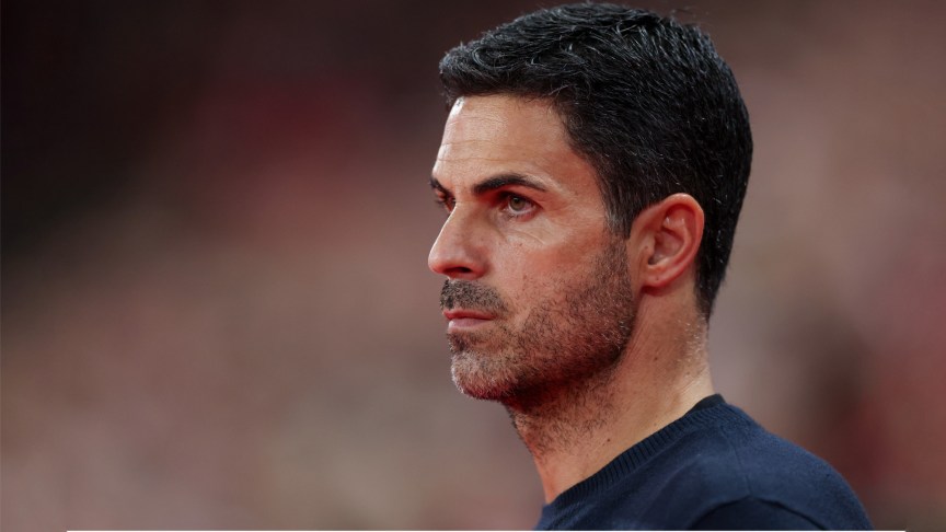 Side-on image of Arsenal manager Mikel Arteta looking onwards.