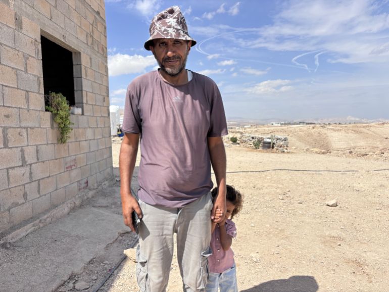 Jamal Mleihat with his daughter Sewar in al-Awsaj in the occupied West Bank [Al Jazeera]