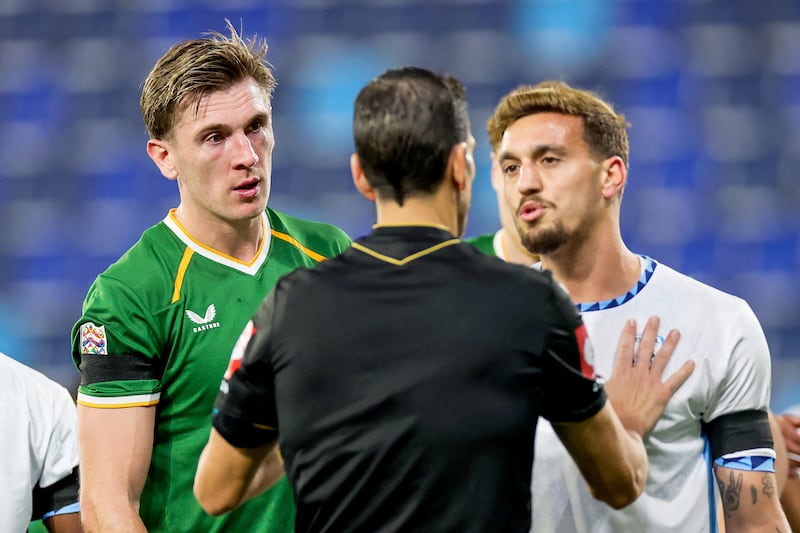 Referee Juan Martínez Munuera speaks with Israel's Yarden Shua and Ireland's Jimmy Dunne during Sunday's Nations League match at TSC Arena, Backa Topola, Serbia. Photograph: Ryan Byrne/Inpho