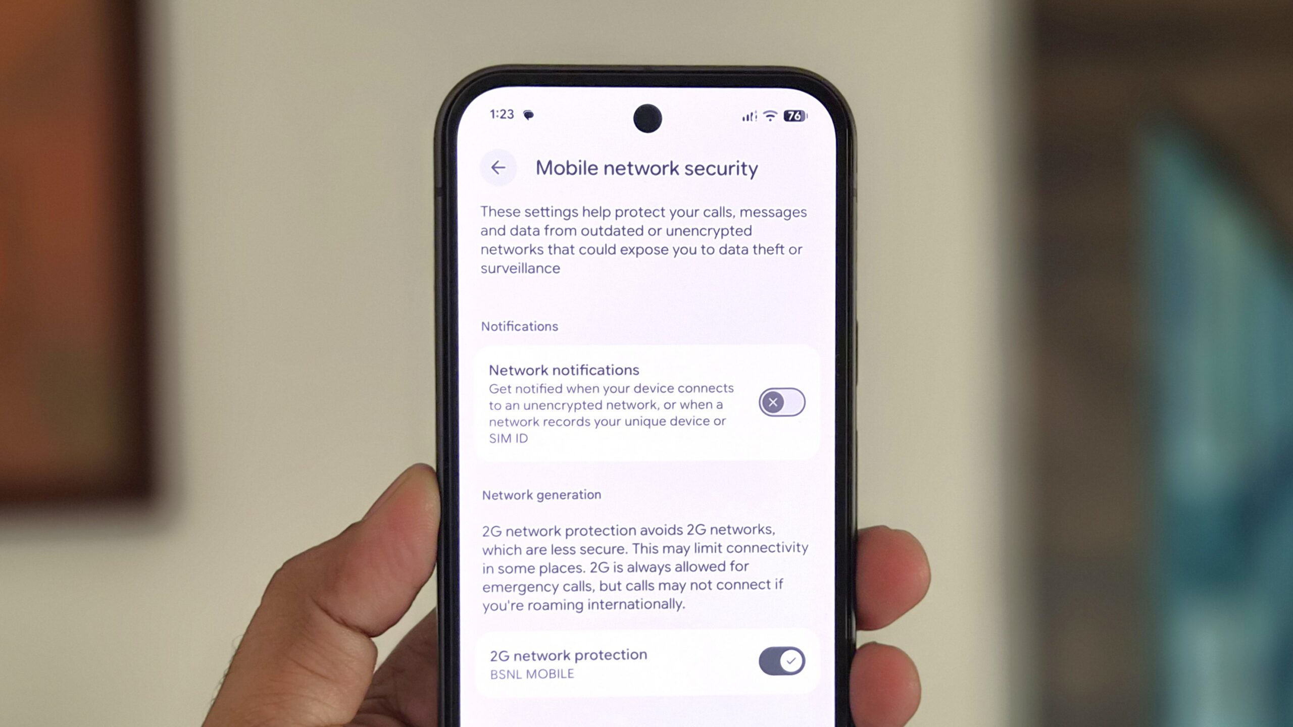 Pixel phone in hand showing mobile network settings