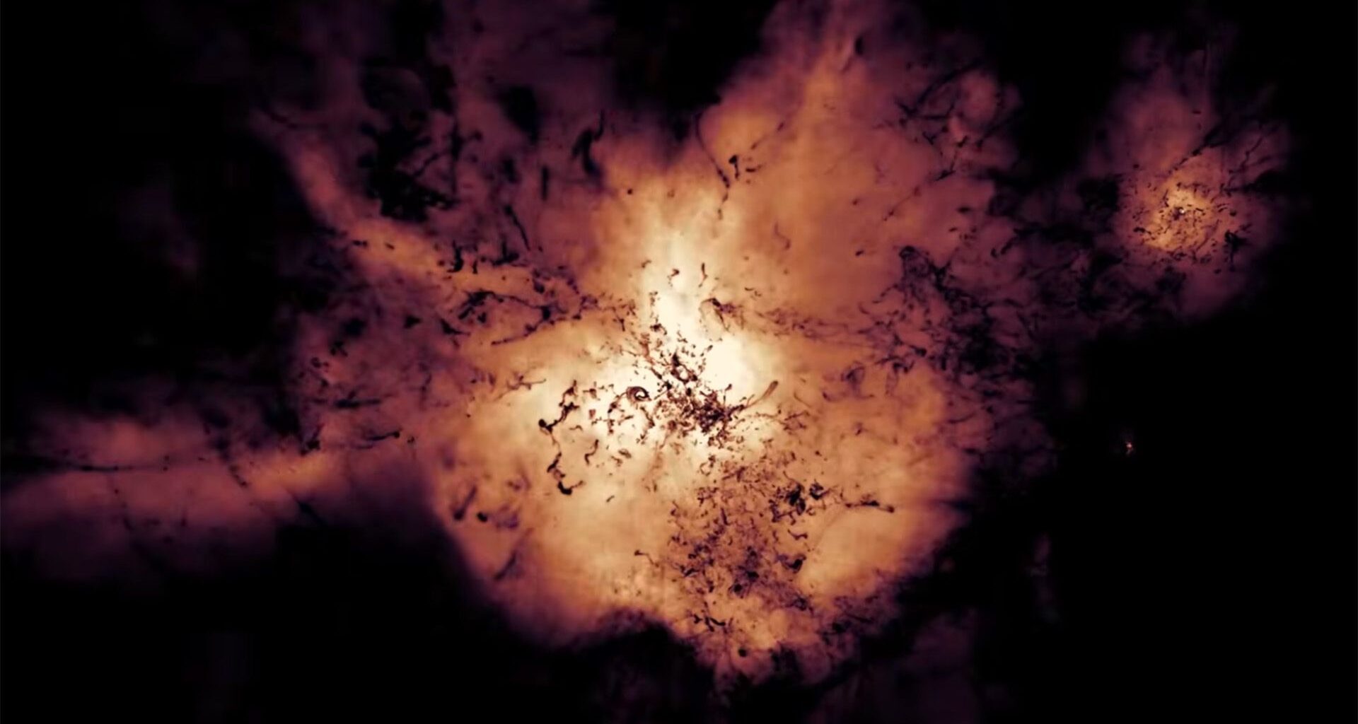 An illustration of a glowing ball of gas expanding out against a dark background