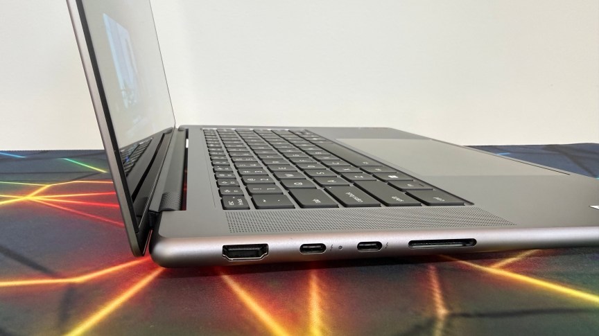 Side view of the Yoga Pro 7i chassis, showing off the ports and charging capabilities as seen on the left side of the computer.