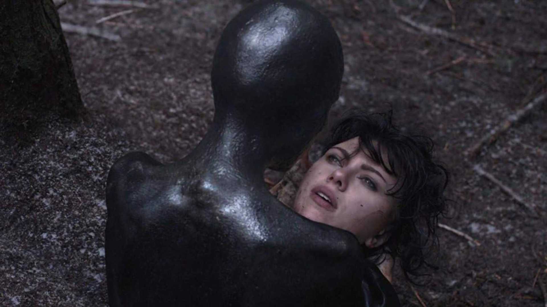 a humanoid figure attacks Scarlett Johansson in under the skin