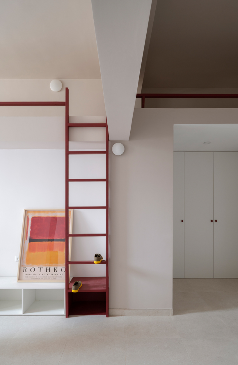 garnet-red accents and high clerestories punctuate AA Apartments in málaga - 4