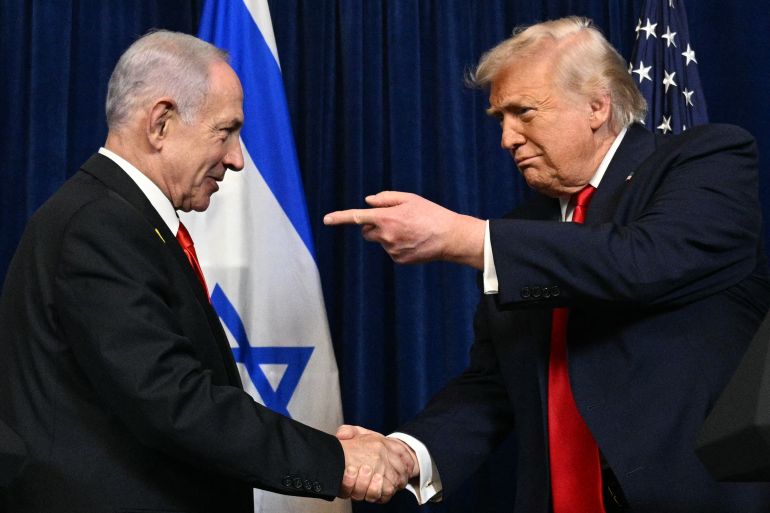 (FILES) US President Donald Trump (R) and Israeli Prime Minister Benjamin Netanyahu shake hands as they arrive to speak to journalists during a joint press conference at Trump’s Mar-a-Lago residence in Palm Beach, Florida, on December 29, 2025.