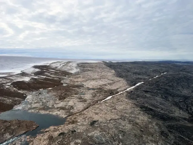 an ice cap in the distance, a line across the landscape