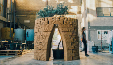robotically 3D printed earth bricks wrap multispecies habitat around olive tree