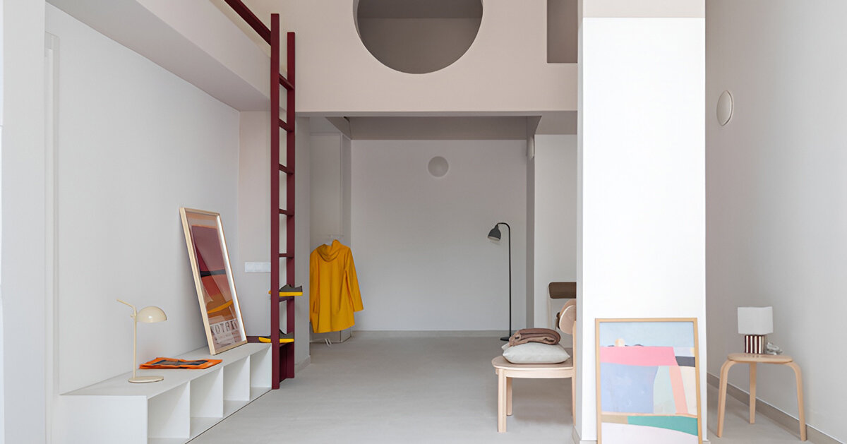 garnet-red accents and high clerestories punctuate AA Apartments in málaga