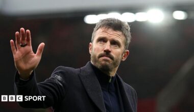 Michael Carrick waves to fans after Manchester United's defeat at home to Bournemouth
