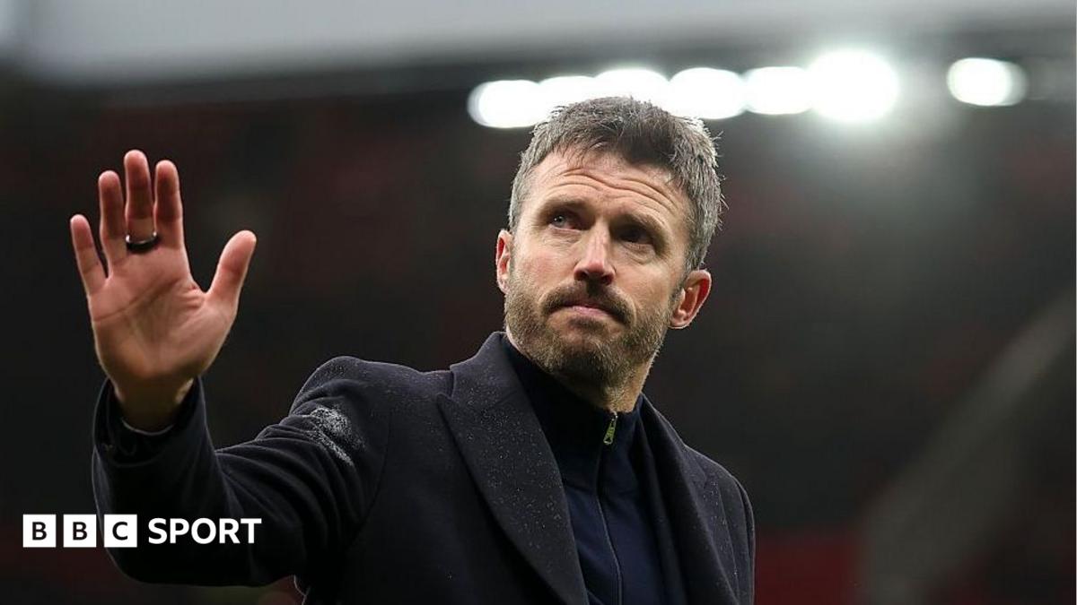Michael Carrick waves to fans after Manchester United's defeat at home to Bournemouth