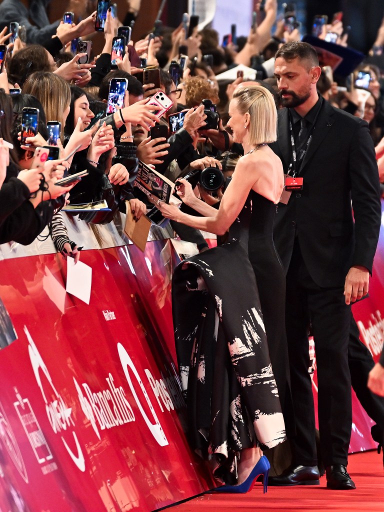 Naomi Watts signs autographs for fans on the red carpet at the Roma Cinema Fest.