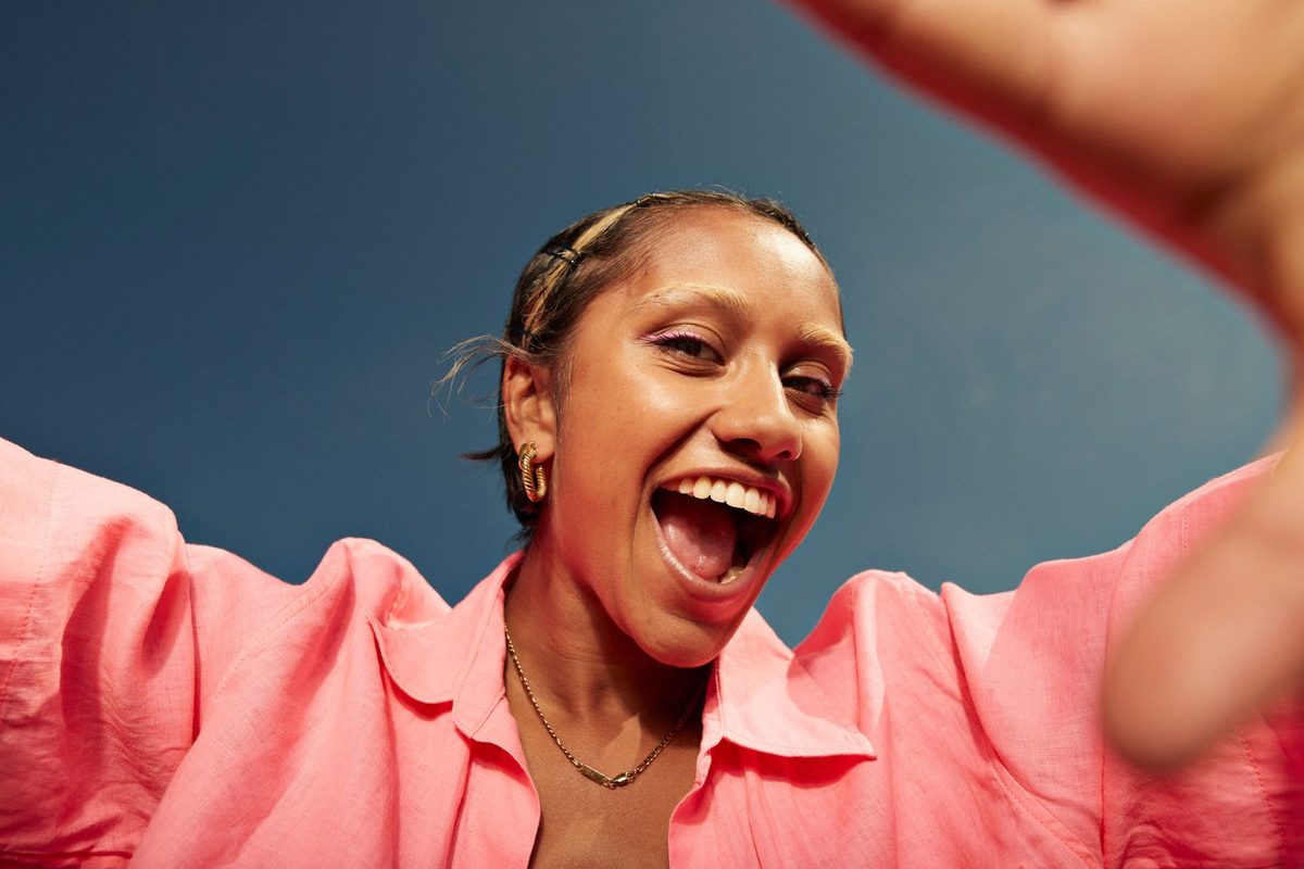 Close-up of happy person wearing pink