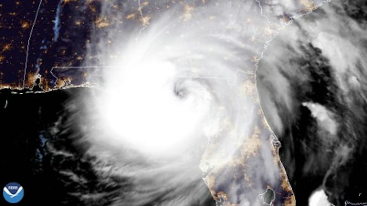 A satellite image of a very large Hurricane Helene hitting the Florida Gulf coast.