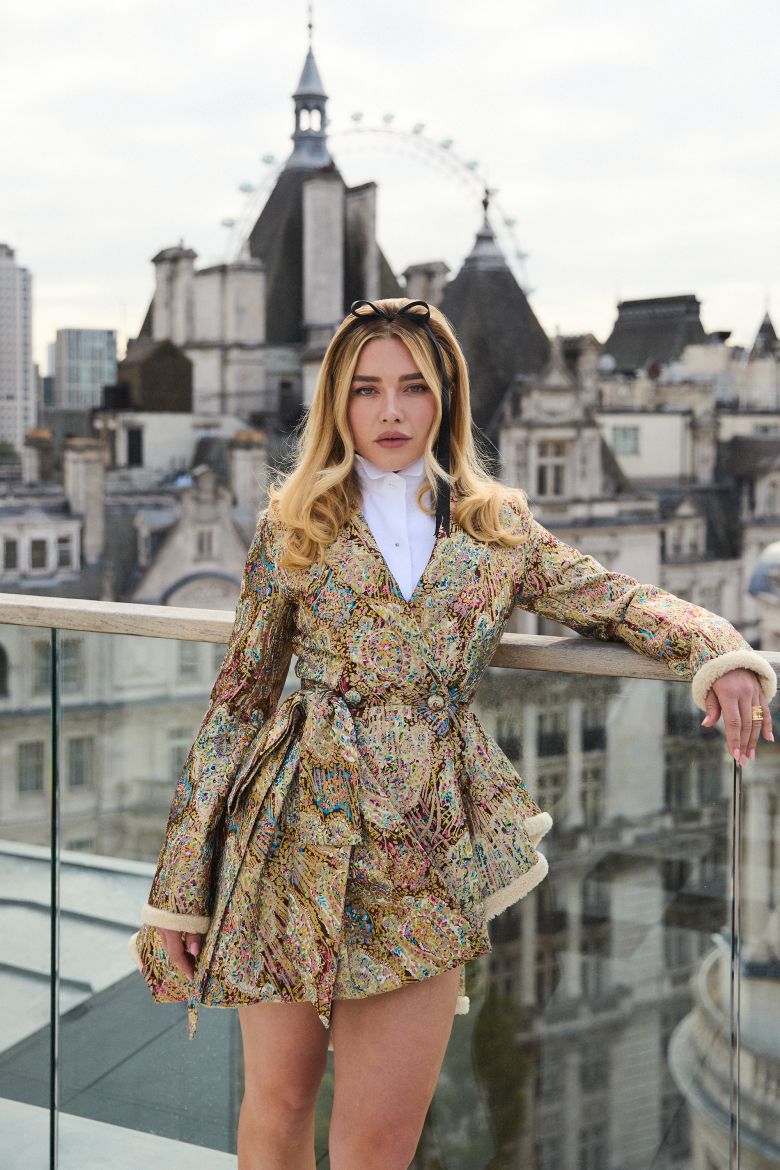 A Dior brocade jacket worn as as a mini dress at a photocall for