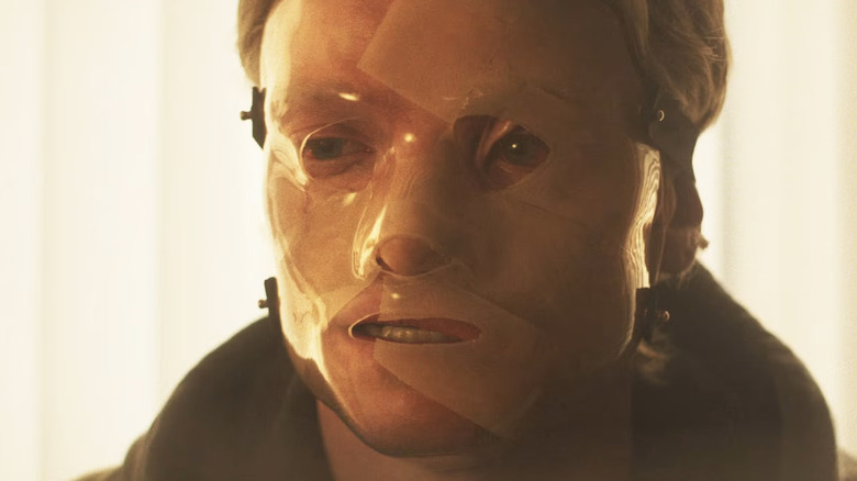 Tom Rhys Harries as Matt Hagen wearing a medical plastic face mask in 