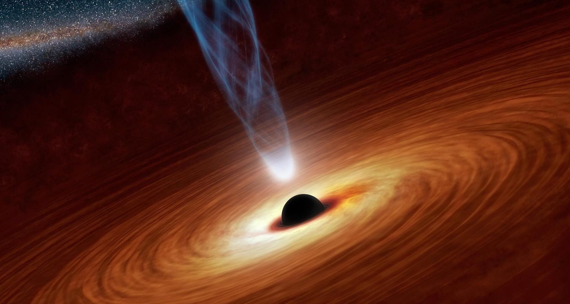 An artist's depiction of a supermassive black hole, showing a dark sphere surrounding by a cloudy yellow-orange disk of dust and gas.