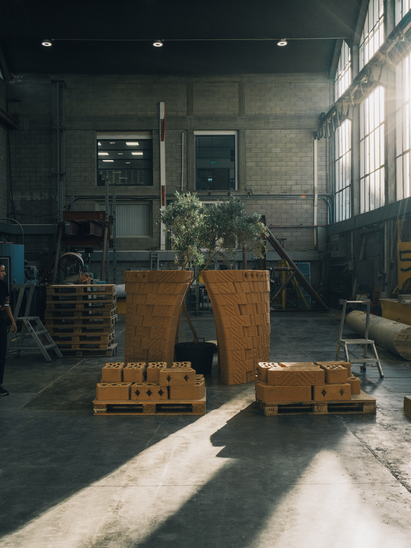 robotically 3d printed earth bricks wrap a multispecies habitat around an olive tree 9