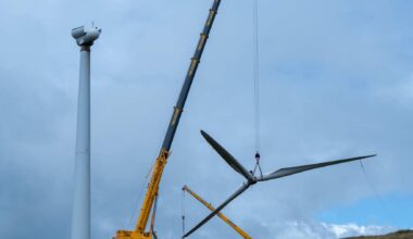 Crane lowering a sawn turbine blade at a Scottish wind farm turbines recycled site, scotland s first